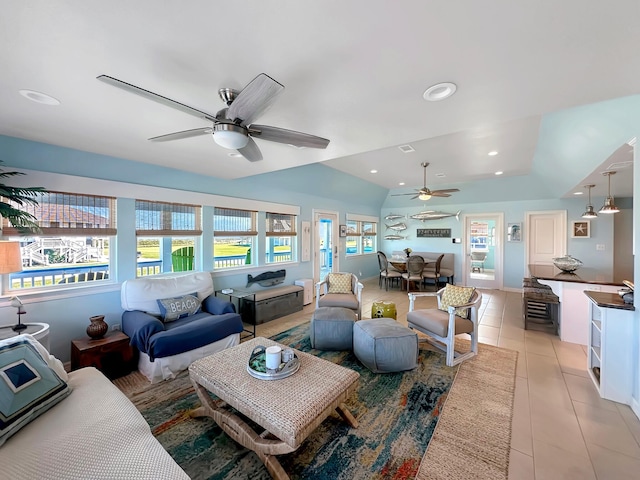 living room featuring lofted ceiling, recessed lighting, light tile patterned floors, and a ceiling fan
