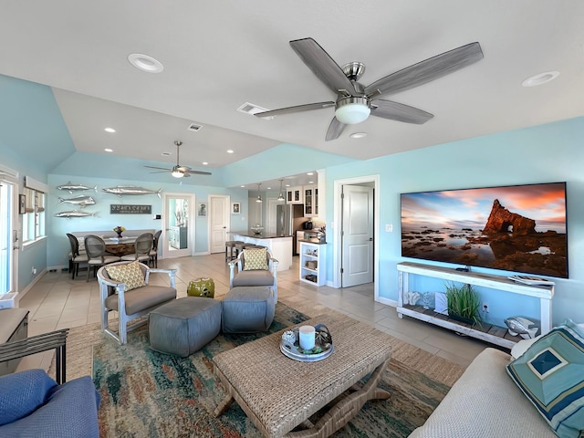 living room with light tile patterned flooring, vaulted ceiling, a ceiling fan, visible vents, and recessed lighting
