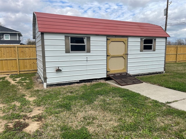 view of shed featuring a fenced backyard