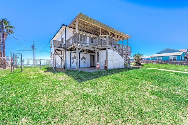 back of property with a gate, stairway, fence, and a wooden deck