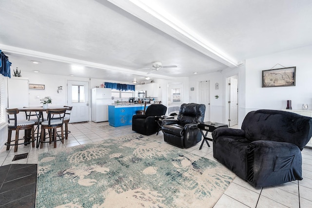 living room featuring light tile patterned floors and ceiling fan