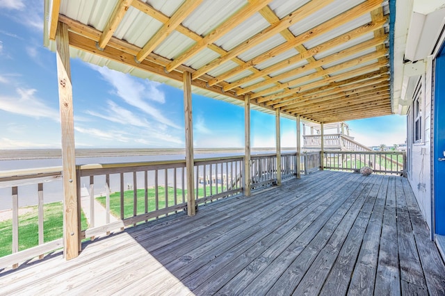 wooden terrace with stairway and a water view