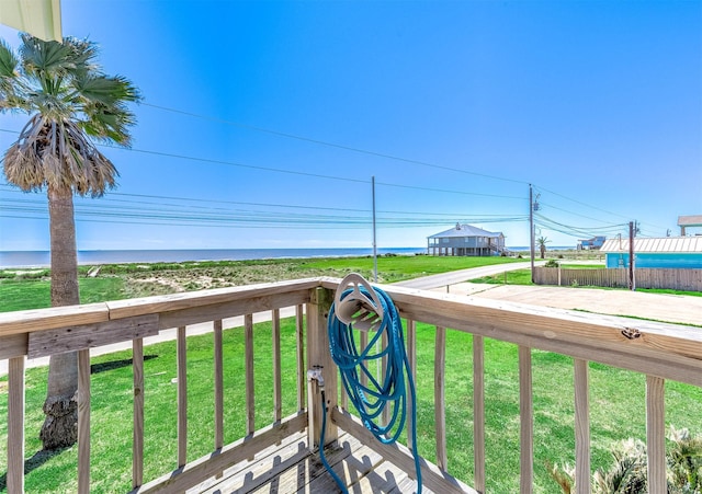 balcony featuring a water view