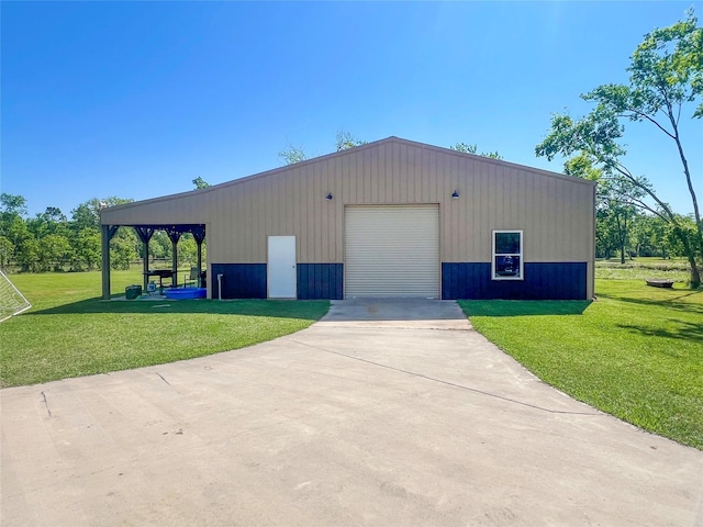 view of outbuilding with an outdoor structure and concrete driveway