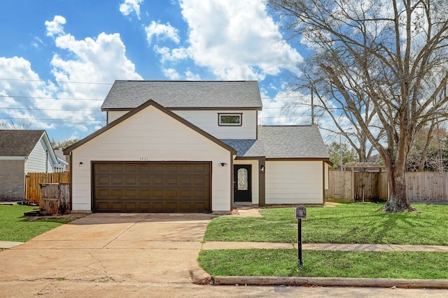 6802 Prairie Village Dr, Katy, TX 77449 - traditional-style home with an attached garage, fence, a front lawn, and roof with shingles