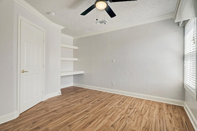 6802 Prairie Village Dr, Katy, TX 77449 - unfurnished room with visible vents, crown molding, and wood finished floors