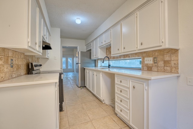 5860 Sampley Way Unit 5860, Houston, TX 77092 - kitchen with tasteful backsplash, stainless steel appliances, light countertops, and a sink