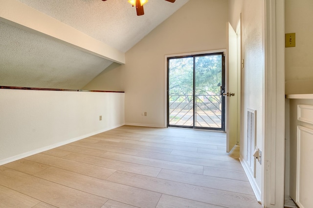 5860 Sampley Way Unit 5860, Houston, TX 77092 - additional living space with a textured ceiling, light wood-type flooring, vaulted ceiling with beams, baseboards, and ceiling fan