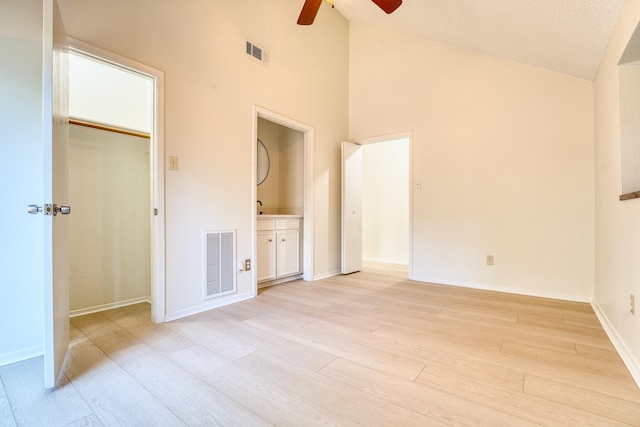 5860 Sampley Way Unit 5860, Houston, TX 77092 - unfurnished bedroom with high vaulted ceiling, baseboards, light wood-style floors, and visible vents