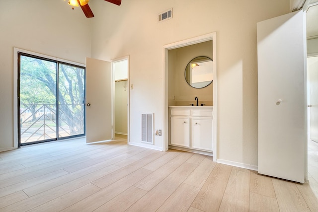 5860 Sampley Way Unit 5860, Houston, TX 77092 - unfurnished bedroom featuring a spacious closet, a towering ceiling, visible vents, and access to outside