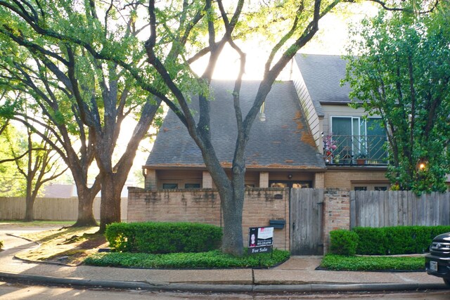 5860 Sampley Way Unit 5860, Houston, TX 77092 - view of front of home featuring a gate, brick siding, a shingled roof, and a fenced front yard