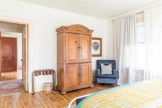 261 N Water St, La Grange, TX 78945 - bedroom with light wood-style floors