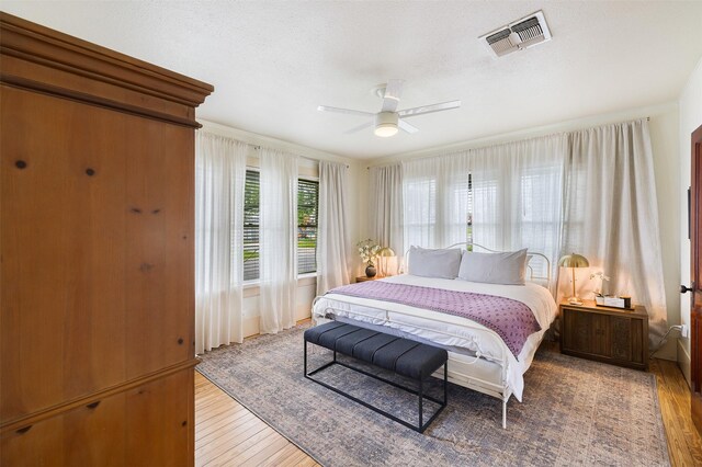 261 N Water St, La Grange, TX 78945 - bedroom with light wood-style floors, ceiling fan, and visible vents