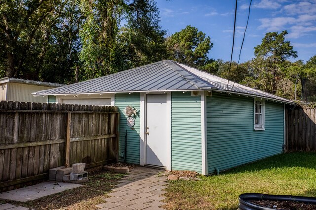 607 Center St, Brenham, TX 77833 - view of outbuilding featuring fence and an outdoor structure