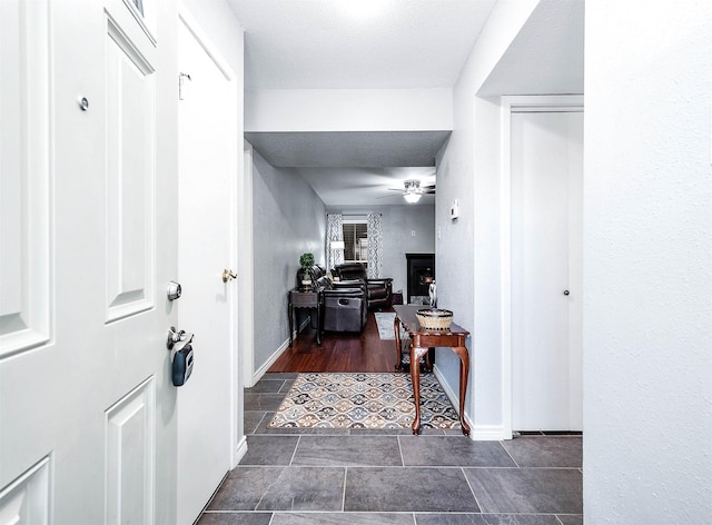 7600 Emmett F Lowry Expy Unit 807, Texas City, TX 77591 - corridor featuring baseboards and dark tile patterned flooring
