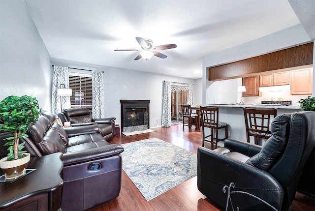 7600 Emmett F Lowry Expy Unit 807, Texas City, TX 77591 - living room with a ceiling fan, dark wood-style floors, and a premium fireplace