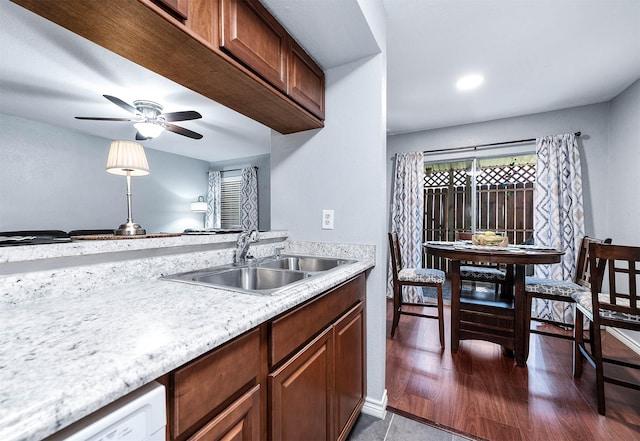 7600 Emmett F Lowry Expy Unit 807, Texas City, TX 77591 - kitchen with a sink, light countertops, dishwasher, ceiling fan, and dark wood-style flooring