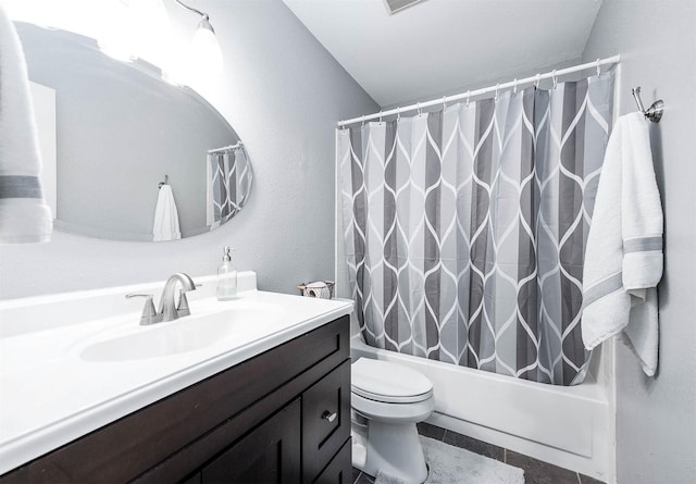 7600 Emmett F Lowry Expy Unit 807, Texas City, TX 77591 - bathroom with vanity, shower / bath combo with shower curtain, and toilet