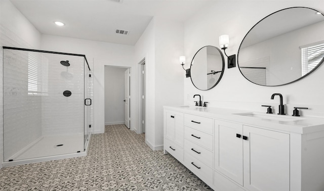 924 Wormwood Dr, League City, TX 77573 - bathroom with double vanity, a shower stall, and recessed lighting
