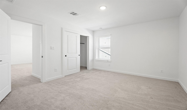 924 Wormwood Dr, League City, TX 77573 - unfurnished bedroom with light carpet, a closet, and recessed lighting