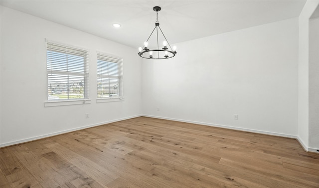 924 Wormwood Dr, League City, TX 77573 - unfurnished room featuring a chandelier, light wood-style flooring, and recessed lighting