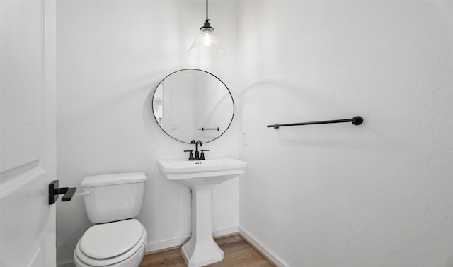 924 Wormwood Dr, League City, TX 77573 - half bath with wood finished floors and toilet