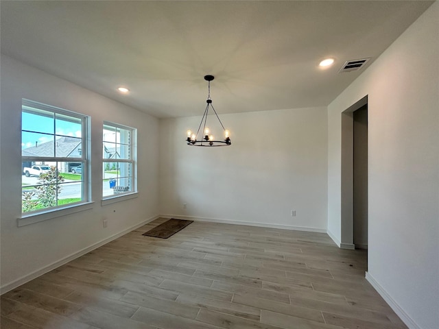 924 Wormwood Dr, League City, TX 77573 - unfurnished dining area featuring a chandelier, light wood-type flooring, and recessed lighting