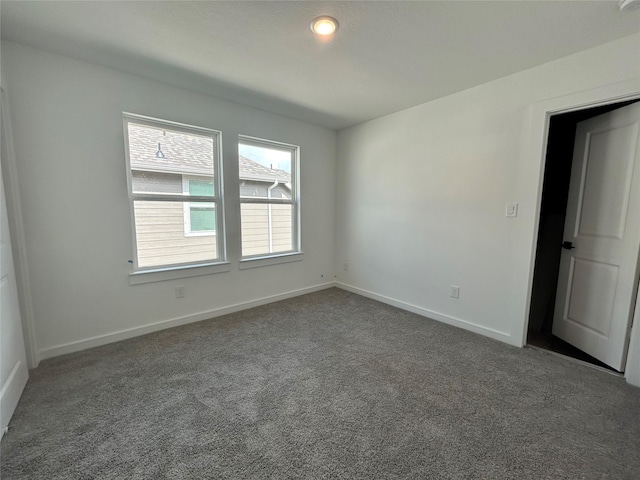 924 Wormwood Dr, League City, TX 77573 - spare room featuring carpet and baseboards