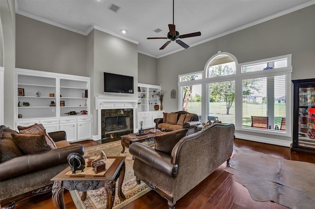 108 Somerton Dr, Montgomery, TX 77356 - living area featuring a premium fireplace, crown molding, ceiling fan, dark wood-style floors, and recessed lighting