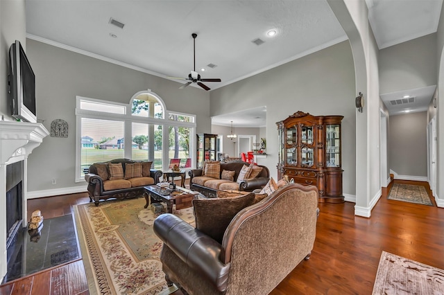 108 Somerton Dr, Montgomery, TX 77356 - living room with a ceiling fan, a fireplace with flush hearth, dark wood-style floors, baseboards, and crown molding