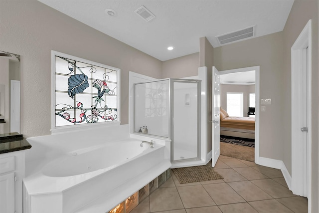 108 Somerton Dr, Montgomery, TX 77356 - bathroom featuring a shower stall, a jetted tub, tile patterned floors, and connected bathroom