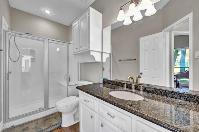 108 Somerton Dr, Montgomery, TX 77356 - full bathroom featuring a shower stall, vanity, toilet, and tile patterned flooring