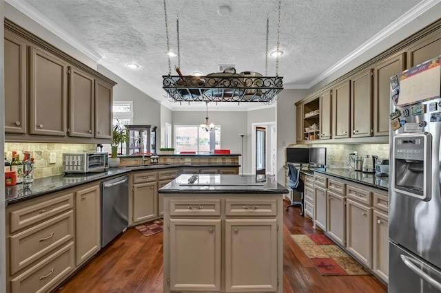 108 Somerton Dr, Montgomery, TX 77356 - kitchen featuring stainless steel appliances, a peninsula, crown molding, a chandelier, and a sink