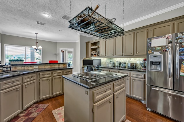 108 Somerton Dr, Montgomery, TX 77356 - kitchen with stainless steel refrigerator with ice dispenser, black electric stovetop, a textured ceiling, dark wood-style floors, and crown molding