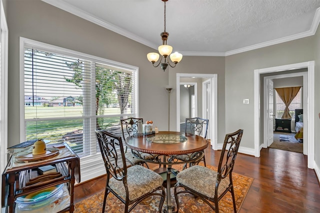 108 Somerton Dr, Montgomery, TX 77356 - dining area with ornamental molding, dark wood-style floors, a chandelier, baseboards, and a textured ceiling