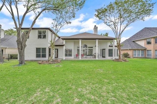 108 Somerton Dr, Montgomery, TX 77356 - rear view of house with a chimney and a patio area
