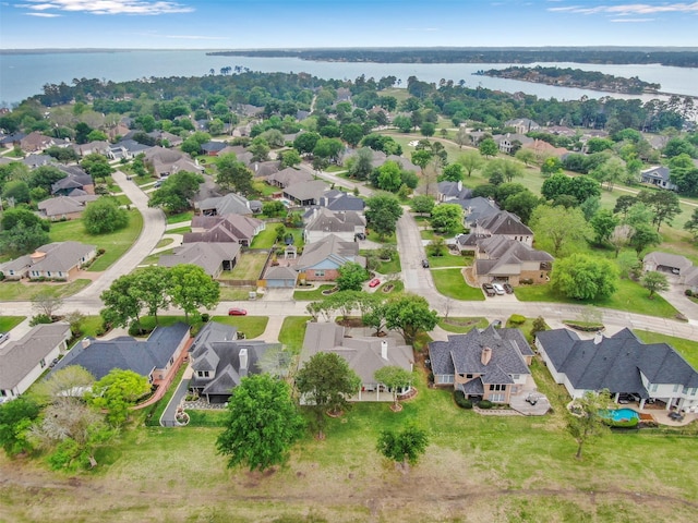 108 Somerton Dr, Montgomery, TX 77356 - aerial view of property's location with nearby suburban area and a large body of water
