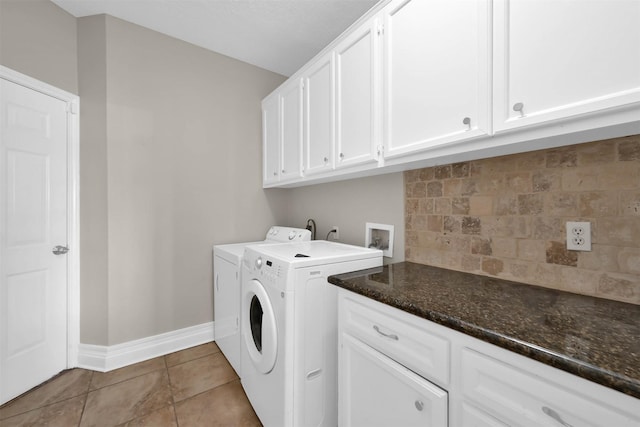 108 Somerton Dr, Montgomery, TX 77356 - washroom with separate washer and dryer, cabinet space, baseboards, and light tile patterned floors