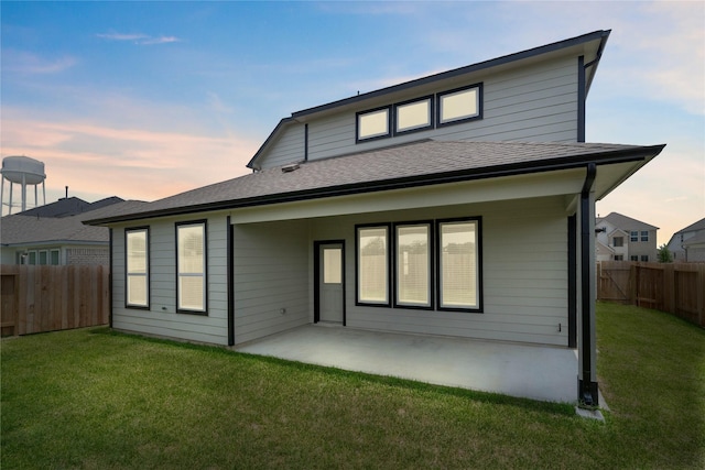 365 Spruce Oak Ln, Waller, TX 77484 - back of house at dusk featuring a patio and roof with shingles