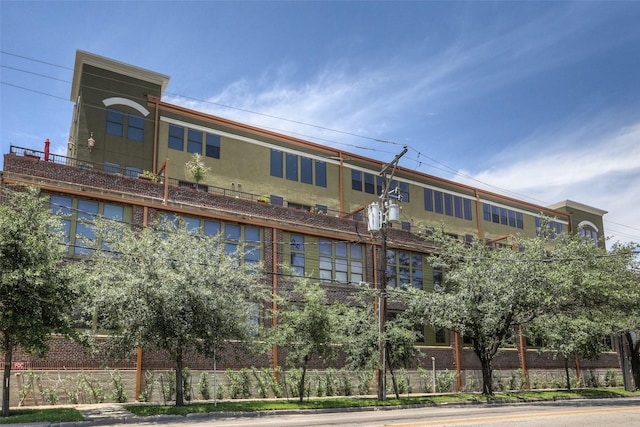 view of building exterior featuring fence