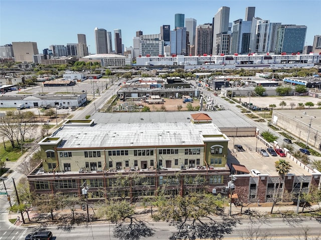 birds eye view of property with a view of city