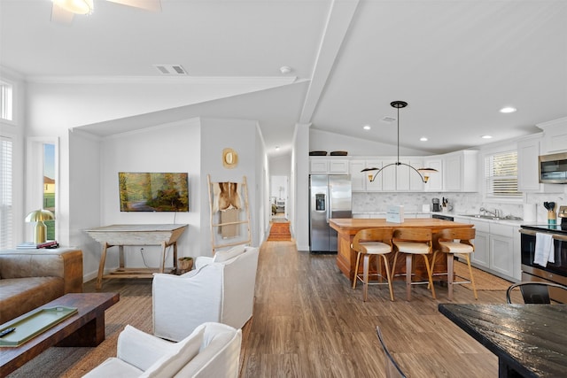 1731 Spur 458, Carmine, TX 78932 - living area featuring dark wood finished floors, recessed lighting, and baseboards