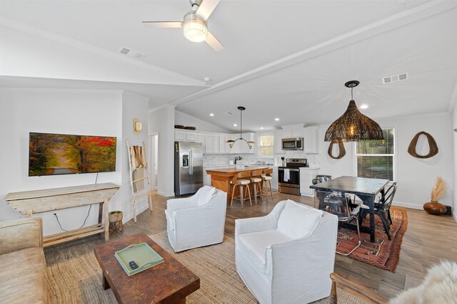 1731 Spur 458, Carmine, TX 78932 - living room featuring vaulted ceiling, light wood-style flooring, baseboards, recessed lighting, and ceiling fan