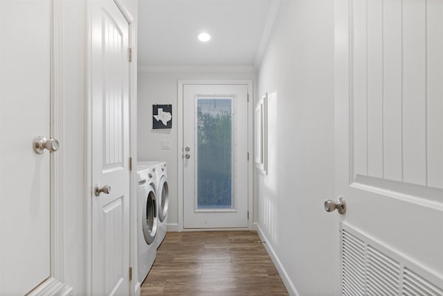 1731 Spur 458, Carmine, TX 78932 - clothes washing area with washing machine and clothes dryer, crown molding, wood finished floors, baseboards, and recessed lighting