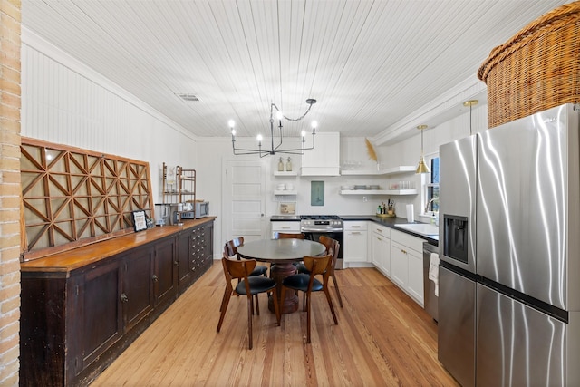 1731 Spur 458, Carmine, TX 78932 - kitchen featuring stainless steel appliances, open shelves, a sink, ornamental molding, and a chandelier