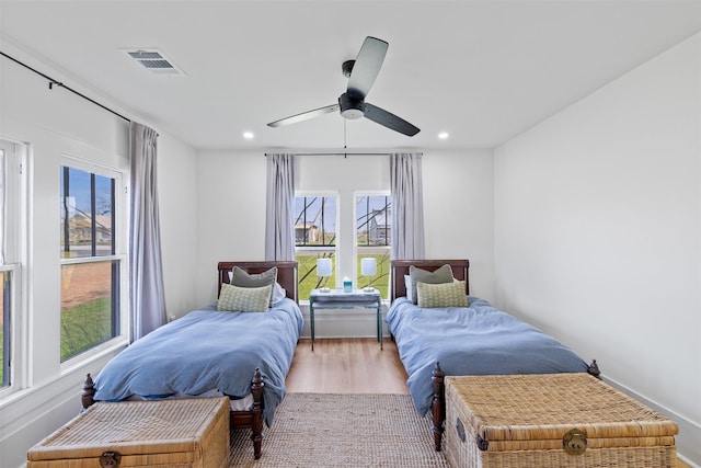 1731 Spur 458, Carmine, TX 78932 - bedroom with wood finished floors, a ceiling fan, and recessed lighting