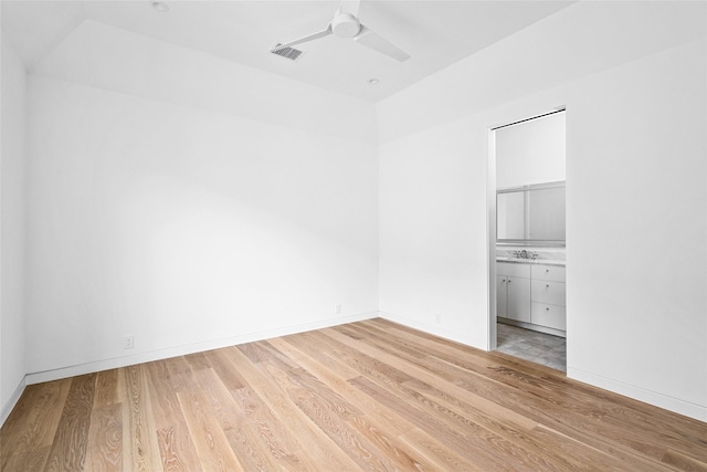 2215 Albans Rd, Houston, TX 77005 - unfurnished room featuring wood finished floors, ceiling fan, vaulted ceiling, baseboards, and a sink