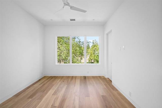 2215 Albans Rd, Houston, TX 77005 - empty room featuring light wood-style floors, baseboards, and ceiling fan
