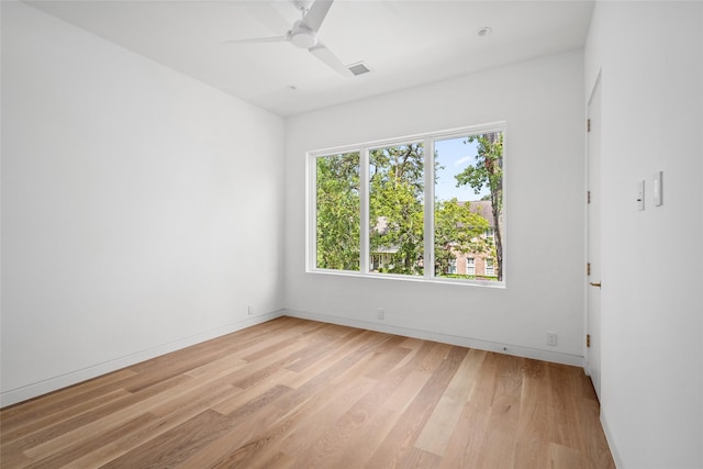 2215 Albans Rd, Houston, TX 77005 - empty room featuring light wood-type flooring, ceiling fan, and baseboards
