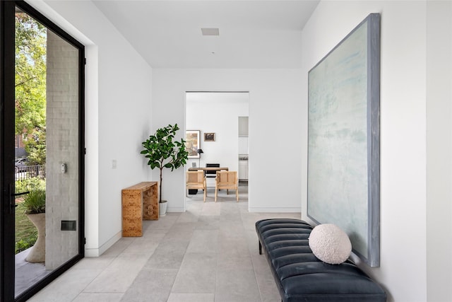 2215 Albans Rd, Houston, TX 77005 - hallway with light tile patterned floors and baseboards